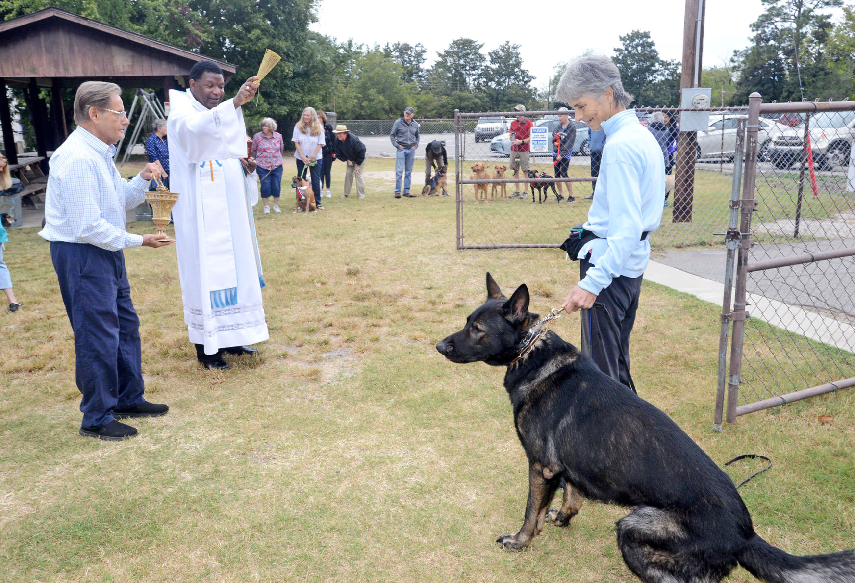 Pastor Fr. Andrew McNair blesses a dog